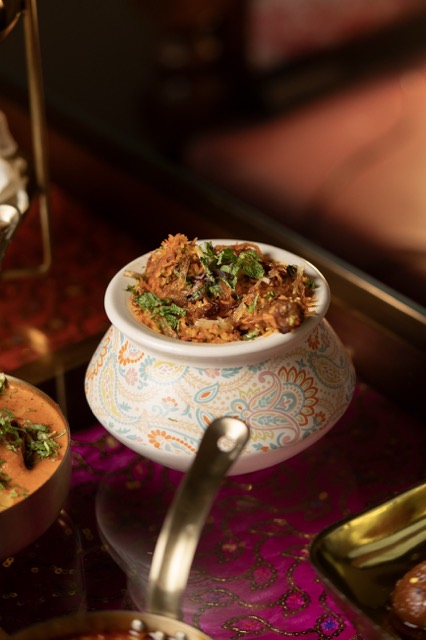 Handi biryani in a painted pot